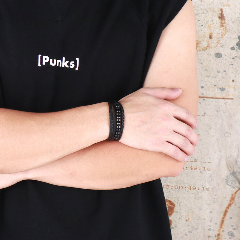 Multi-layered black leather bracelet with stainless steel accents – Hand-woven unique jewelry