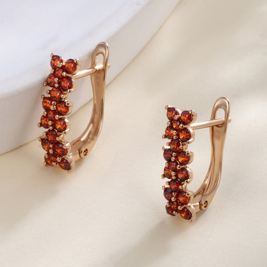 Flower-shaped ear clips with garnet zirconia - 18K gold-plated copper alloy (height 1.5 cm)