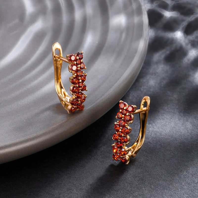 Flower-shaped ear clips with garnet zirconia - 18K gold-plated copper alloy (height 1.5 cm)