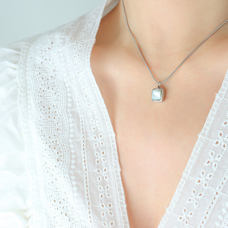 Minimalist square necklace with white shell pendant | Titanium steel 18k gold or steel colors | Understated jewelry design | Scandinavian style