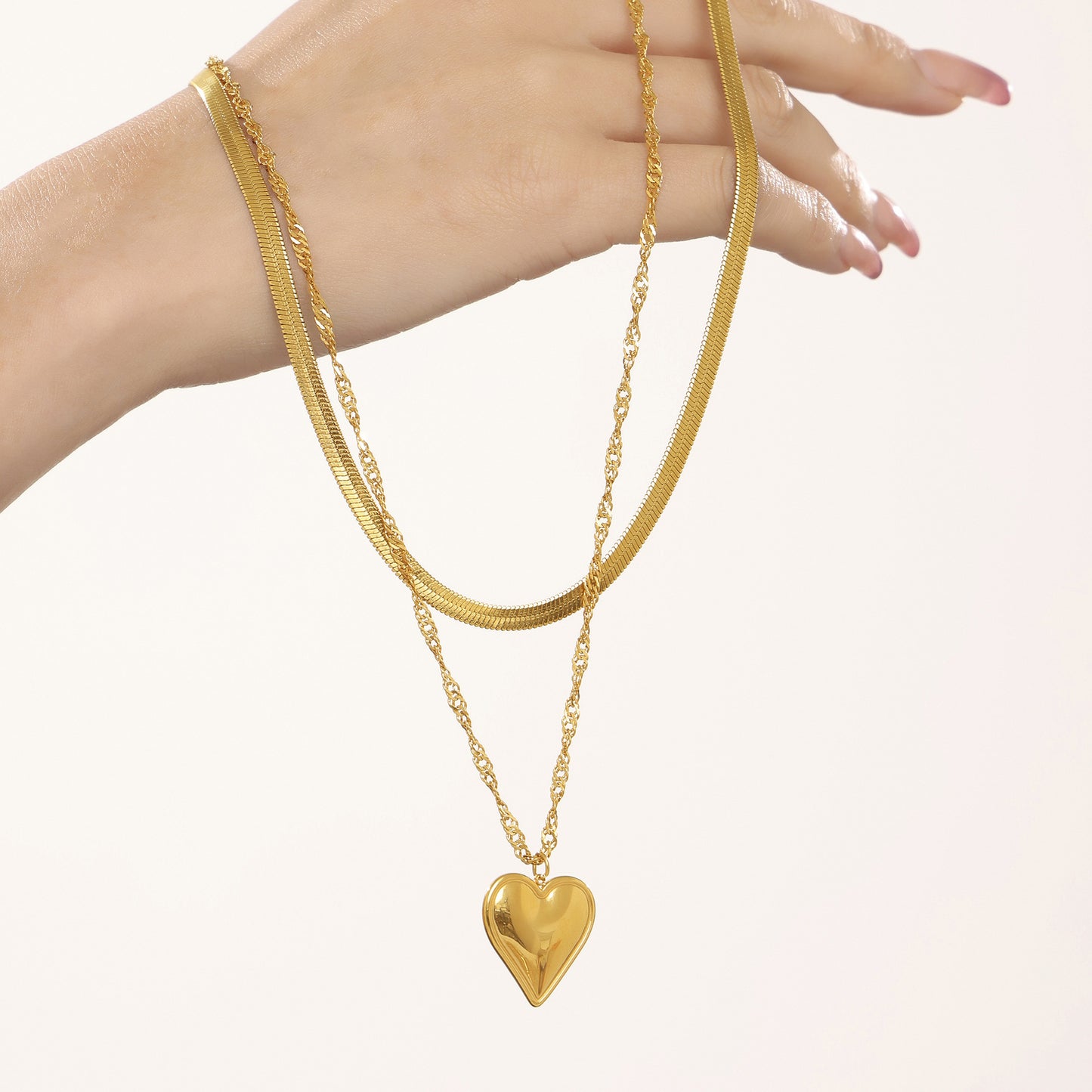Wave-shaped blade chain with heart pendant | Double-layered stainless steel chain in 18K gold or high-gloss silver look