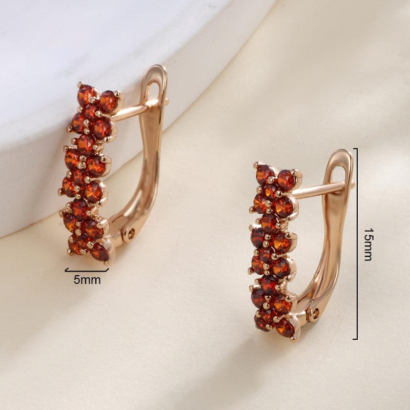 Flower-shaped ear clips with garnet zirconia - 18K gold-plated copper alloy (height 1.5 cm)