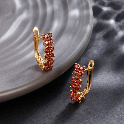 Flower-shaped ear clips with garnet zirconia - 18K gold-plated copper alloy (height 1.5 cm)