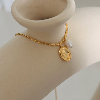 Unique pendant necklace with freshwater pearl &amp; oval plate – gold-plated stainless steel or silver look