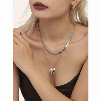 Wave-shaped blade chain with heart pendant | Double-layered stainless steel chain in 18K gold or high-gloss silver look