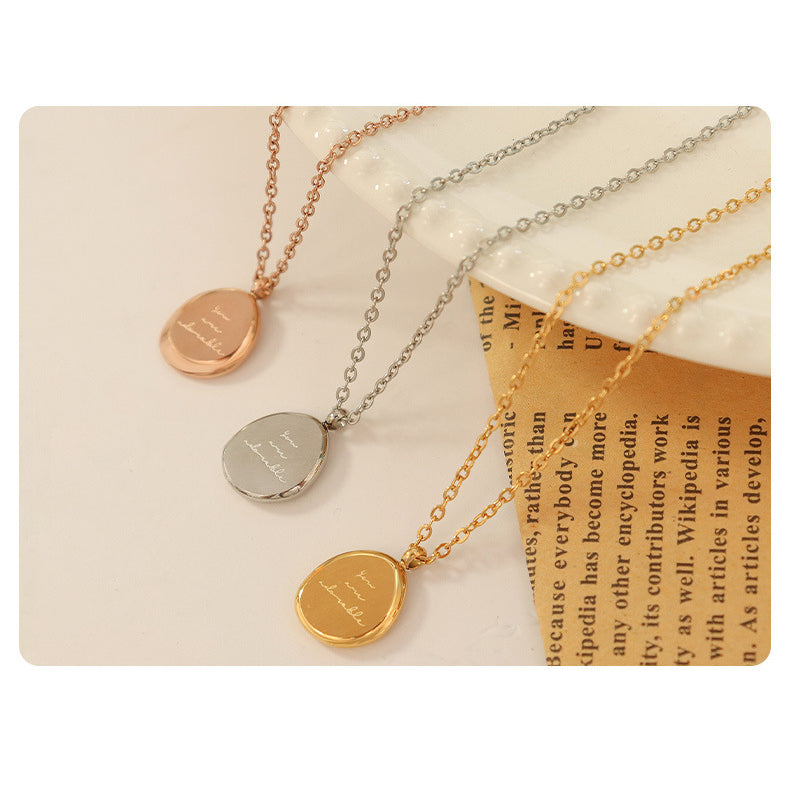 Irregular oval pendant - necklace made of gold-plated stainless steel