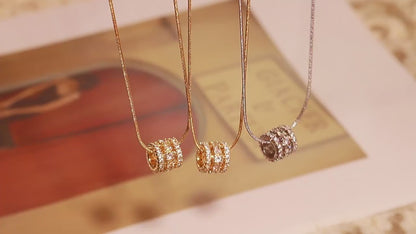 Multi-layered cylinder pendant with zirconia stones | Stainless steel chain in 18K gold or high-gloss silver